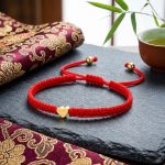 Exclusive: Red String Heart Bracelet - Professional Photo