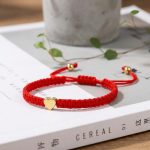 Exclusive: Red String Heart Bracelet - Professional Photo