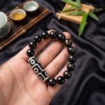 Ultimate Luck DZI 9 Eyes Obsidian Bracelet - Professional Photo